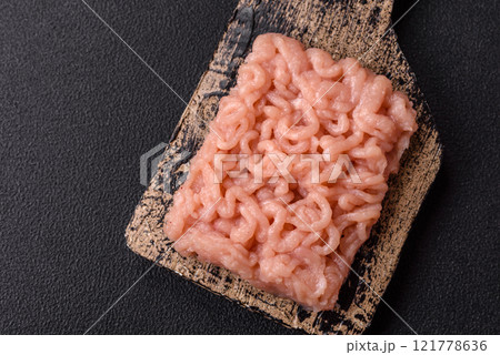 Fresh raw chicken mince with salt, spices and herbs 121778636