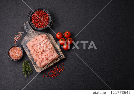 Fresh raw chicken mince with salt, spices and herbs Fresh raw chicken mince with salt, spices and herbs 121778642