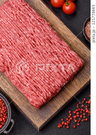 Fresh raw ground beef with salt, spices and herbs Fresh raw ground beef with salt, spices and herbs 121778665