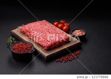 Fresh raw ground beef with salt, spices and herbs Fresh raw ground beef with salt, spices and herbs 121778666