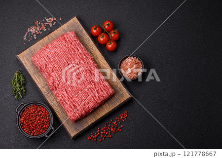 Fresh raw ground beef with salt, spices and herbs Fresh raw ground beef with salt, spices and herbs 121778667
