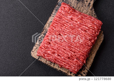 Fresh raw ground beef with salt, spices and herbs Fresh raw ground beef with salt, spices and herbs 121778680