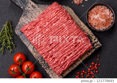 Fresh raw ground beef with salt, spices and herbs Fresh raw ground beef with salt, spices and herbs 121778683