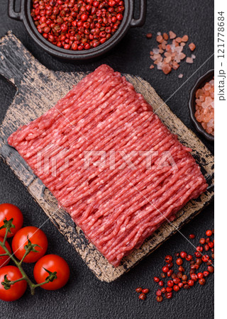 Fresh raw ground beef with salt, spices and herbs Fresh raw ground beef with salt, spices and herbs 121778684