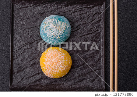 Delicious colorful asian mochi sweets with rice dough shell and fruit filling Delicious colorful asian mochi sweets with rice dough shell and fruit filling 121778890