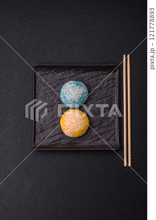 Delicious colorful asian mochi sweets with rice dough shell and fruit filling 121778893