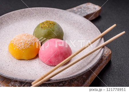 Delicious colorful asian mochi sweets with rice dough shell and fruit filling Delicious colorful asian mochi sweets with rice dough shell and fruit filling 121778951