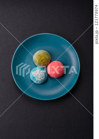 Delicious colorful asian mochi sweets with rice dough shell and fruit filling 121778974