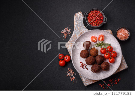 Falafel vegetarian and vegan dish made with chickpeas, spices and herbs Falafel vegetarian and vegan dish made with chickpeas, spices and herbs 121779182