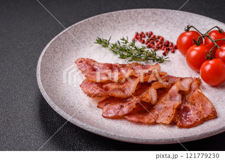 Delicious crispy bacon grilled with salt and spices 121779230