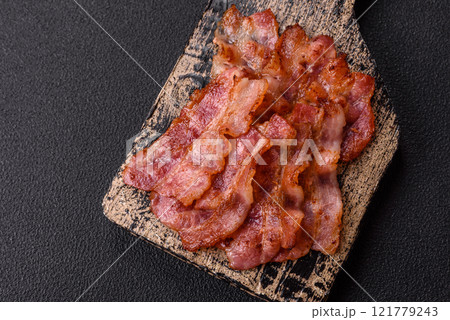 Delicious crispy bacon grilled with salt and spices 121779243