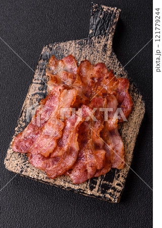 Delicious crispy bacon grilled with salt and spices Delicious crispy bacon grilled with salt and spices 121779244