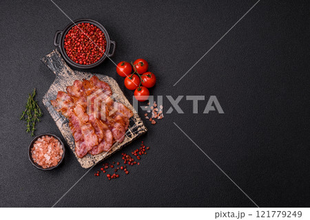 Delicious crispy bacon grilled with salt and spices 121779249