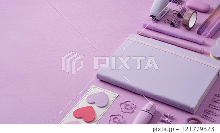 Pastel purple stationery banner with notepad, paper clips, writing supplies, post-its, stapler. Place for your text. Pastel purple stationery banner with notepad, paper clips, writing supplies, post-its, stapler. Place for your text. 121779323