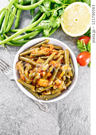 Beans green with vegetables in bowl on granite top 121780563