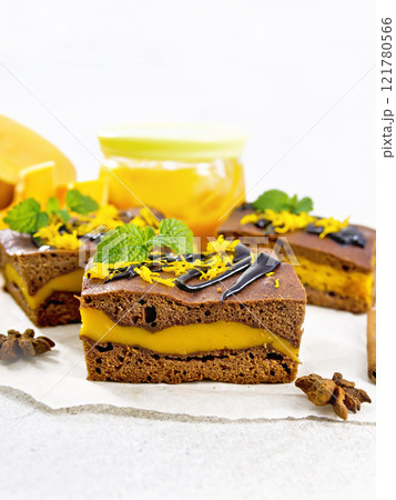 Cake chocolate with pumpkin layer on granite 121780566