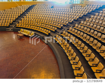 Rows of seats, yellow chairs in an empty conference room, venue for concerts, meetings, performances, plays, seminars. 121780649