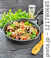 Rolls of eggplant with meat in pan on dark board 121780685