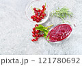 Sauce of redcurrant on granite top 121780692