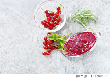 Sauce of redcurrant on granite top Sauce of redcurrant on granite top 121780692