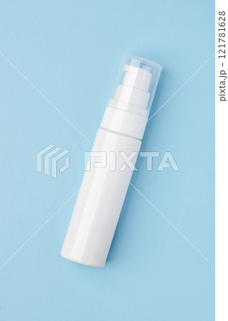 A white cosmetic tube on a pastel blue background 121781628