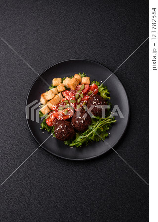Hearty delicious fried falafel made from chickpeas, cumin, hummus with salt and spices Hearty delicious fried falafel made from chickpeas, cumin, hummus with salt and spices 121782384