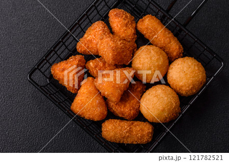 Brie cheese or camembert fries in breading, fast food, takeaway 121782521