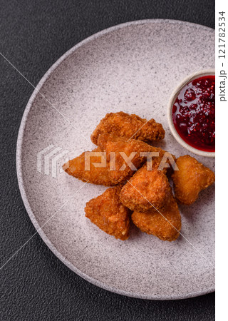 Brie cheese or camembert fries in breading, fast food, takeaway Brie cheese or camembert fries in breading, fast food, takeaway 121782534