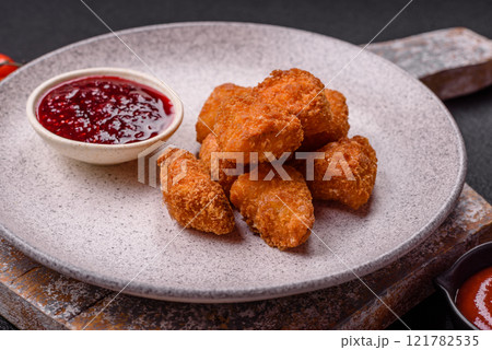 Brie cheese or camembert fries in breading, fast food, takeaway Brie cheese or camembert fries in breading, fast food, takeaway 121782535