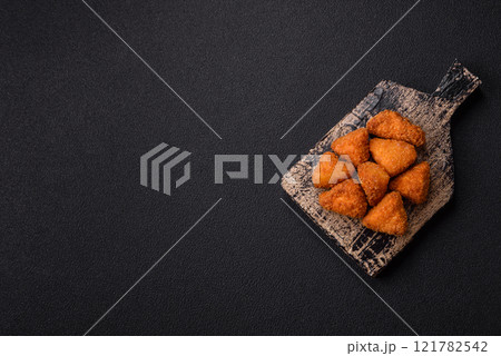 Brie cheese or camembert fries in breading, fast food, takeaway Brie cheese or camembert fries in breading, fast food, takeaway 121782542