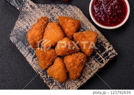 Brie cheese or camembert fries in breading, fast food, takeaway Brie cheese or camembert fries in breading, fast food, takeaway 121782639