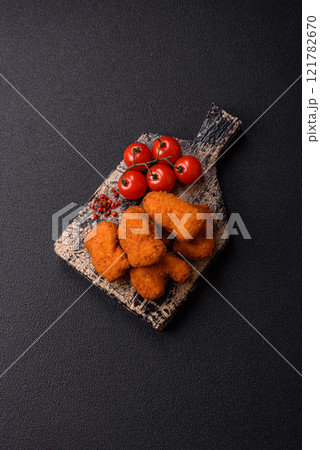 Delicious fresh crispy chicken nuggets, unhealthy food, fast food Delicious fresh crispy chicken nuggets, unhealthy food, fast food 121782670