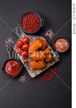Delicious fresh crispy chicken nuggets, unhealthy food, fast food Delicious fresh crispy chicken nuggets, unhealthy food, fast food 121782679