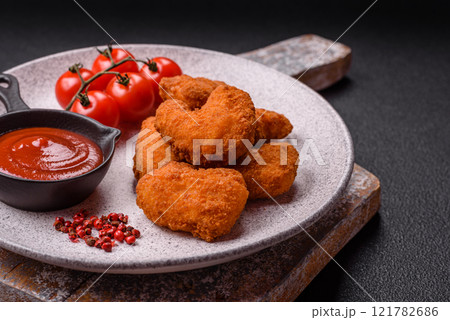 Delicious fresh crispy chicken nuggets, unhealthy food, fast food Delicious fresh crispy chicken nuggets, unhealthy food, fast food 121782686