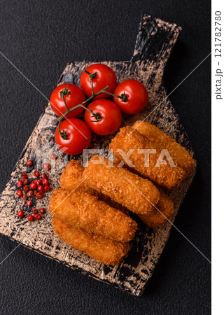 Delicious crispy cheese sticks with mozzarella, salt and spices 121782780