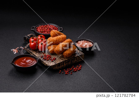 Delicious crispy cheese sticks with mozzarella, salt and spices Delicious crispy cheese sticks with mozzarella, salt and spices 121782784