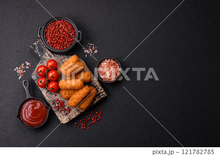 Delicious crispy cheese sticks with mozzarella, salt and spices Delicious crispy cheese sticks with mozzarella, salt and spices 121782785