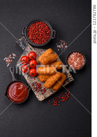 Delicious crispy cheese sticks with mozzarella, salt and spices 121782786