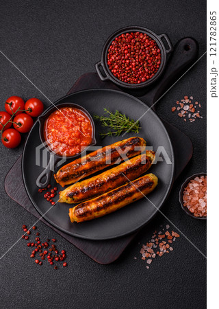 Chicken or pork sausages with salt, spices and herbs 121782865