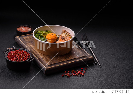 Grilled salmon with salt and spices, broccoli, tomatoes, rice Grilled salmon with salt and spices, broccoli, tomatoes, rice 121783136