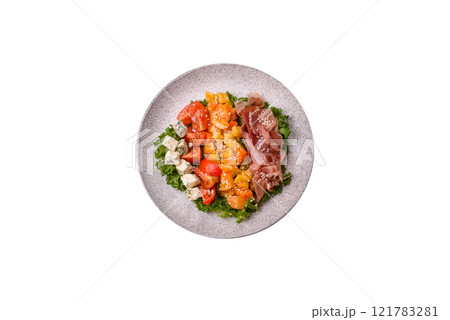 Appetizing salad with prosciutto, pumpkin, cheese and tomatoes Appetizing salad with prosciutto, pumpkin, cheese and tomatoes 121783281