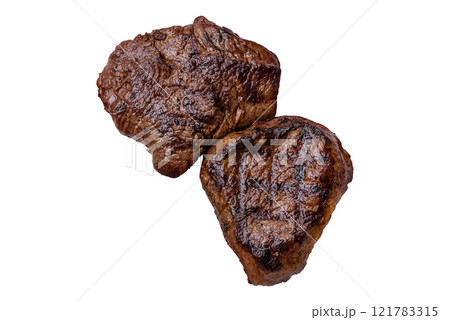 Juicy beef steak baked on the grill with salt, spices and herbs Juicy beef steak baked on the grill with salt, spices and herbs 121783315