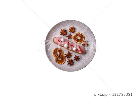 Sweet eclair or profiterole with strawberry custard Sweet eclair or profiterole with strawberry custard 121783351