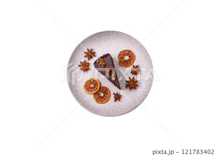 Piece of sweet chocolate cake with nuts Piece of sweet chocolate cake with nuts 121783402