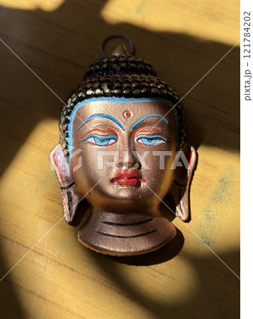 Buddha's head. Buddha's handmade face mask. 121784202