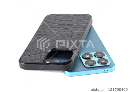 The smartphone case is black crocodile leather on a white background. The smartphone case is black crocodile leather on a white background. 121790569