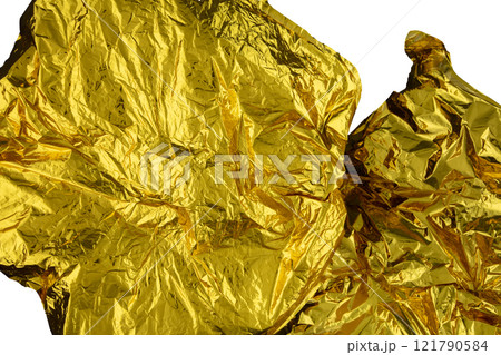 Texture of crumpled gold foil paper on a white background. Texture of crumpled gold foil paper on a white background. 121790584