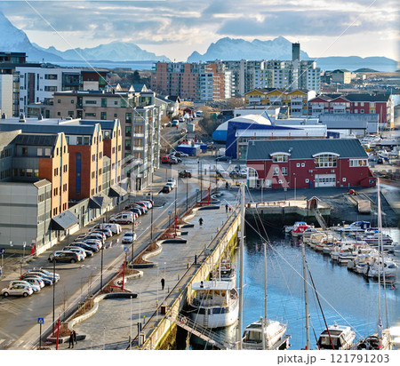 The busy city of Bodo and its surroundings by the harbor and seaside. Landscape view of a dockyard during the day in summer. Small fishing town for tourists and recreational activities for a holiday The busy city of Bodo and its surroundings by the harbor and seaside. Landscape view of a dockyard during the day in summer. Small fishing town for tourists and recreational activities for a holiday 121791203