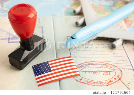 US America flag with passport and airplane for travel. 121791664