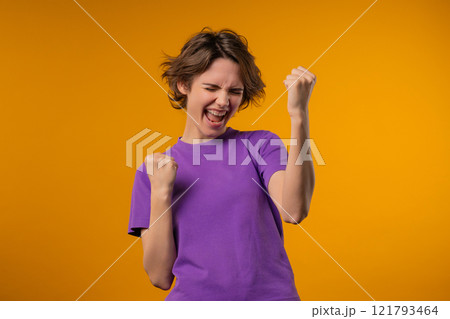 Happy pretty woman shows triumph yes victory gesture, she won jackpot, lottery Happy pretty woman shows triumph yes victory gesture, she won jackpot, lottery 121793464